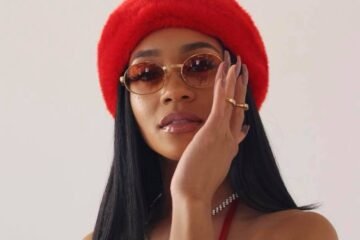 Saweetie press photo with red hat