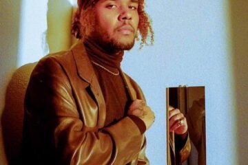 Kyle Dion press photo with one closed fist