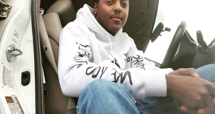 Ron Solemn press photo sitting in a car