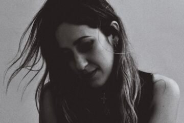 Lyves press photo in a dark light