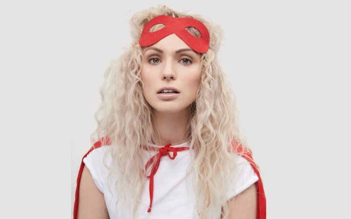 Emmi press photo with red costume