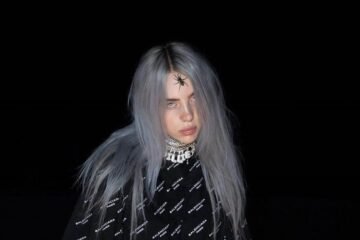 Billie Eilish press photo in the dark