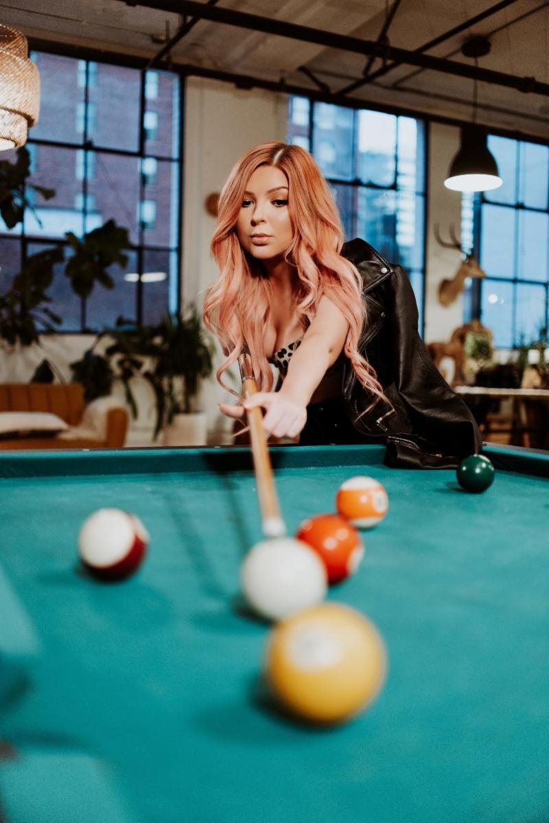 Bianca Ryan press photo playing pool