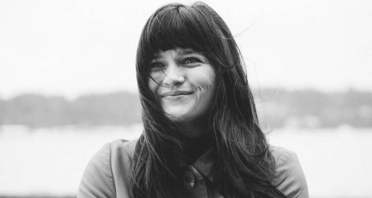 Laura Jean Anderson smiling press photo by Ellyn Jameson