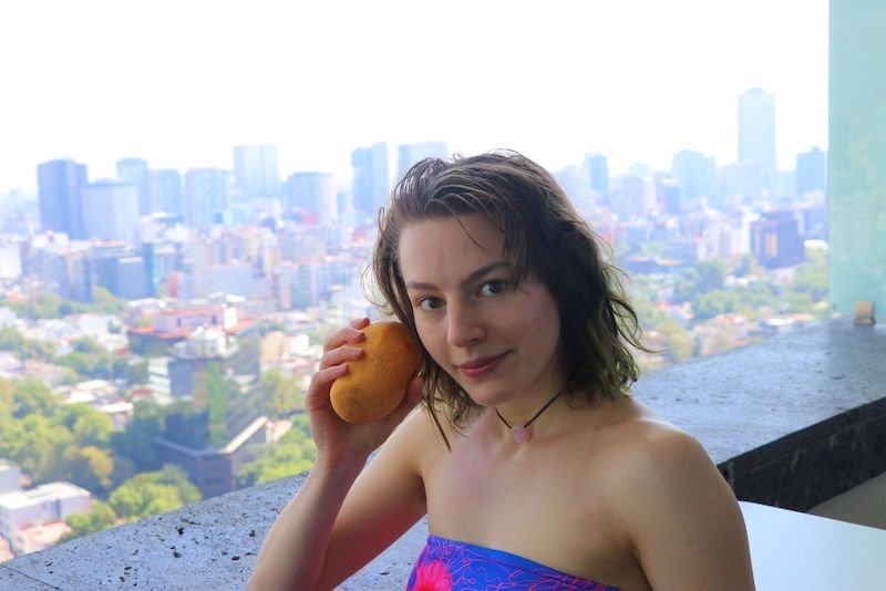 Meresha press photo holding a fruit