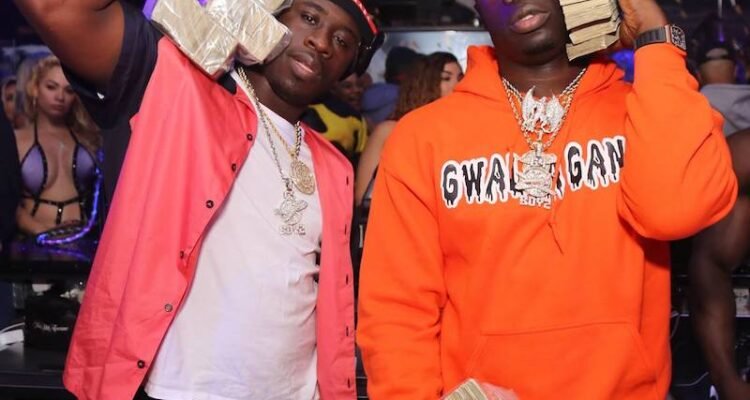 G4 BOYZ press photo wearing holding money