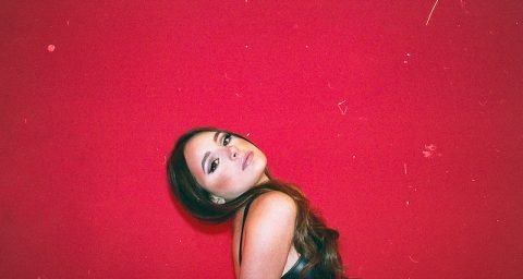 AJA's “Red Button” press photo with red film background.