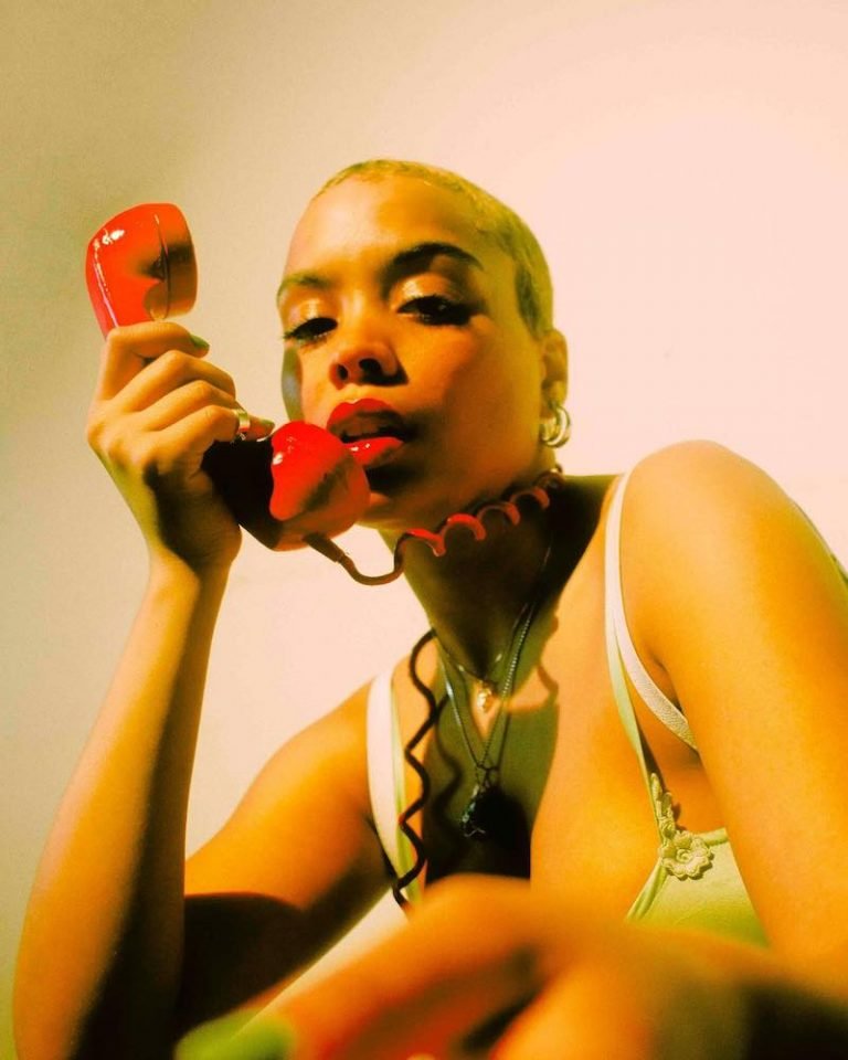 Mighloe's “Don’t Call Me” press photo with red phone.