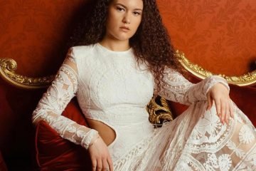 Naomi Cheyanne - “In My Home” EP press photo wearing an elegant white dress