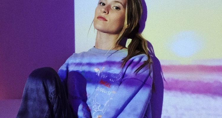 Rosie Darling press photo wearing a purple sweatshirt