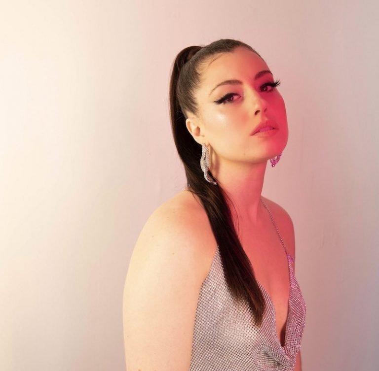 Sara Diamond - “Say My Name Again” press photo wearing a glittery outfit