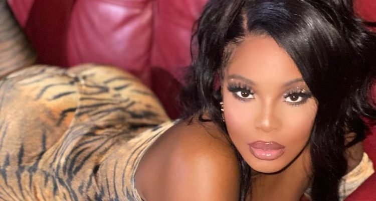 ROE press photo on a maroon/red sofa