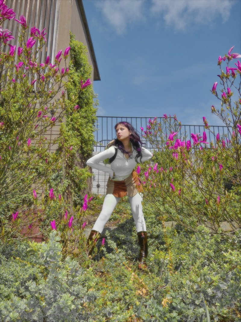 Klara Zangerl press photo outside surrounded by flowers