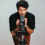 Sebastian Yatra poses for a portrait emulating Elvis Costello's iconic album cover This Year's Model at Hit Factory Studios