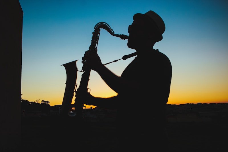 Silhouette of a man playing saxophone 