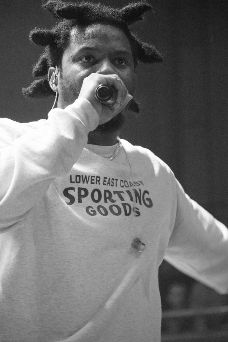 Denzel Curry press photo performing on stage