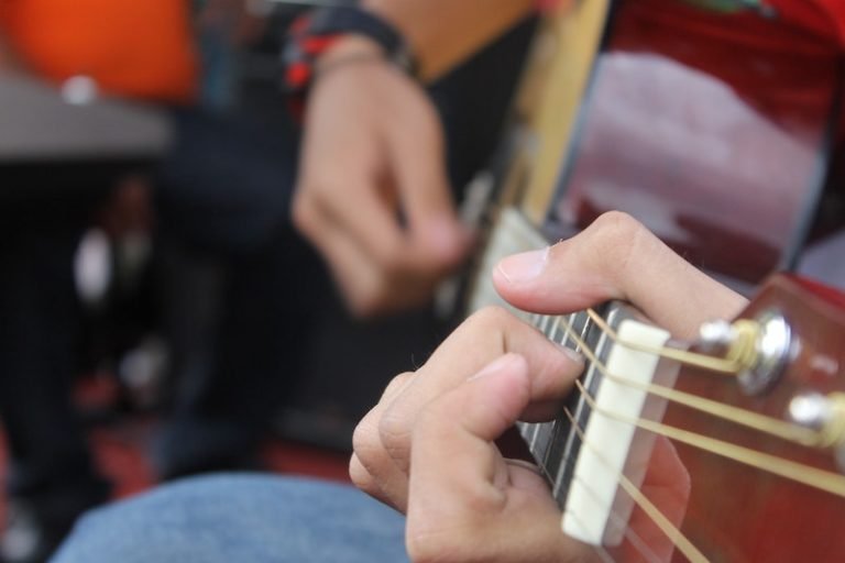 Person playing guitar
