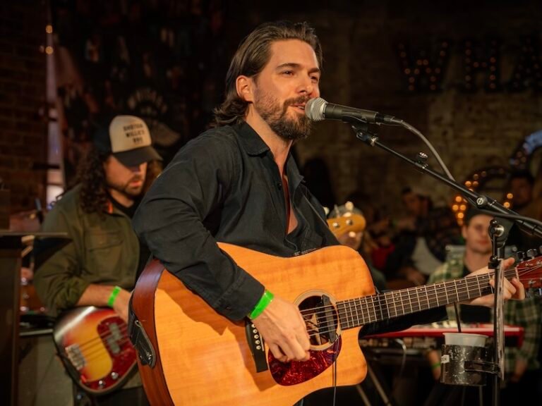 Eric Lee press photo on stage performing