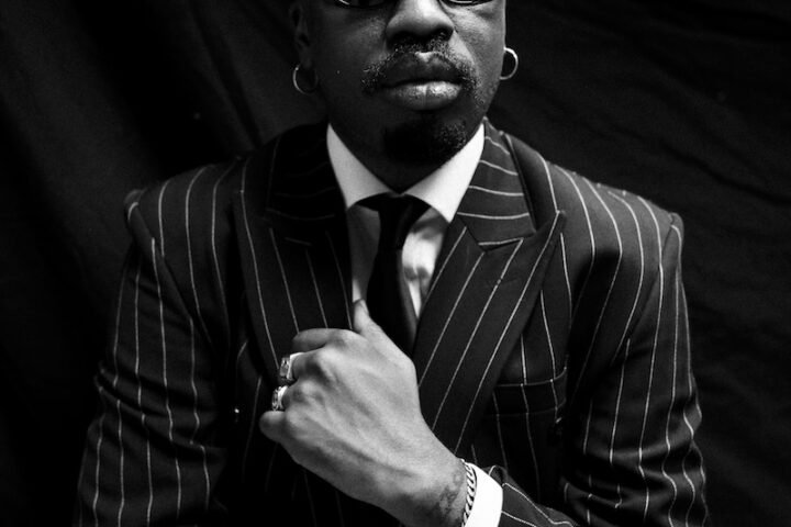 Boj press photo with a suit and tie