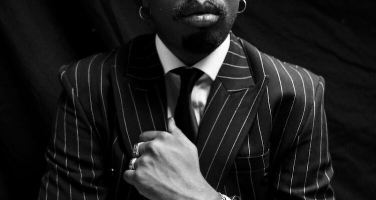 Boj press photo with a suit and tie