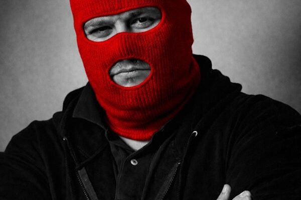 Lofty press photo with red ski mask