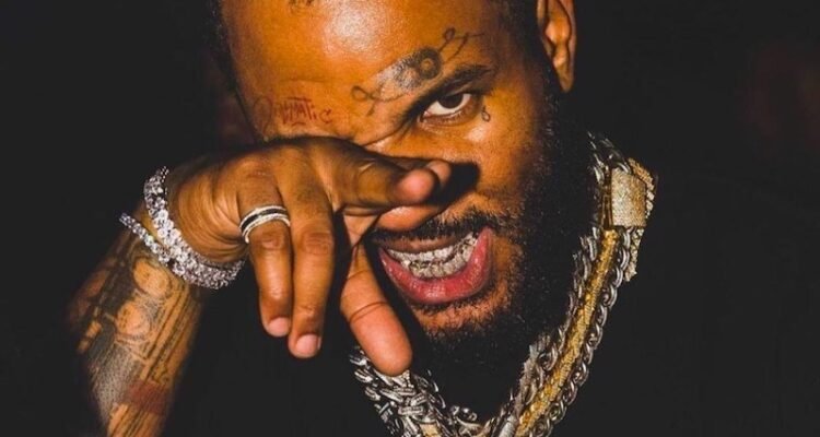 The Game press photo with black t-shirt and jewelry