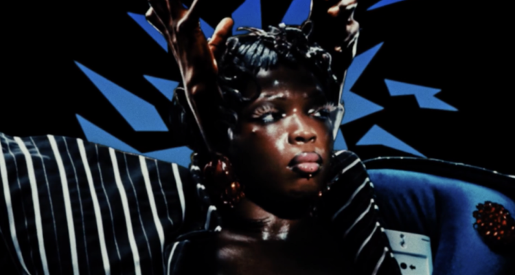 Theodora – Des mythos press photo with Black hands encaging the artist head