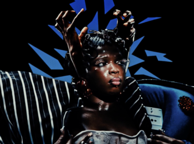 Theodora – Des mythos press photo with Black hands encaging the artist head